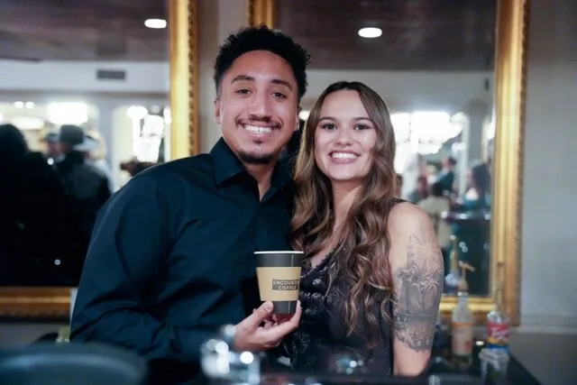 Aziel and Bri Rubero-Diaz, the husband-and-wife owners of Encounter Coffee, behind their cart