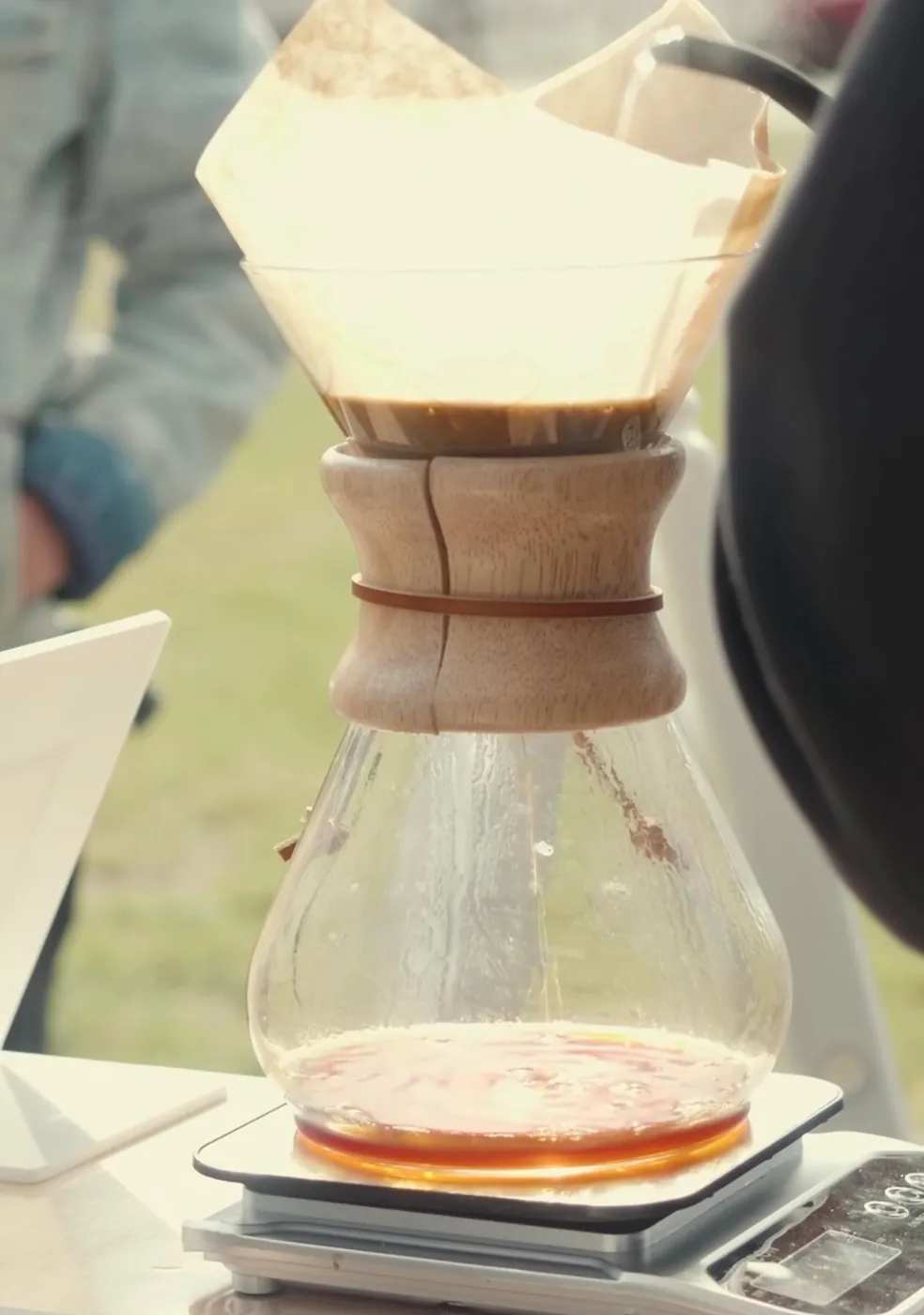 Chemex pour-over brewing on a scale at an Encounter Coffee event setup